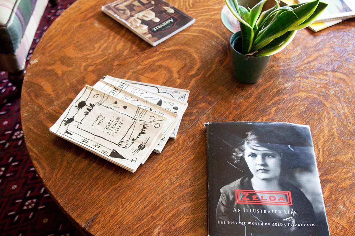 Zelda Fitzgerald magazine and other reading items on a wooden table