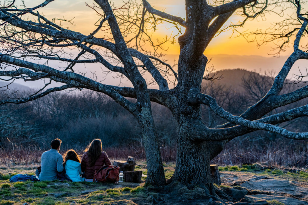 Family having a sunset picnic on Craggy Mountain