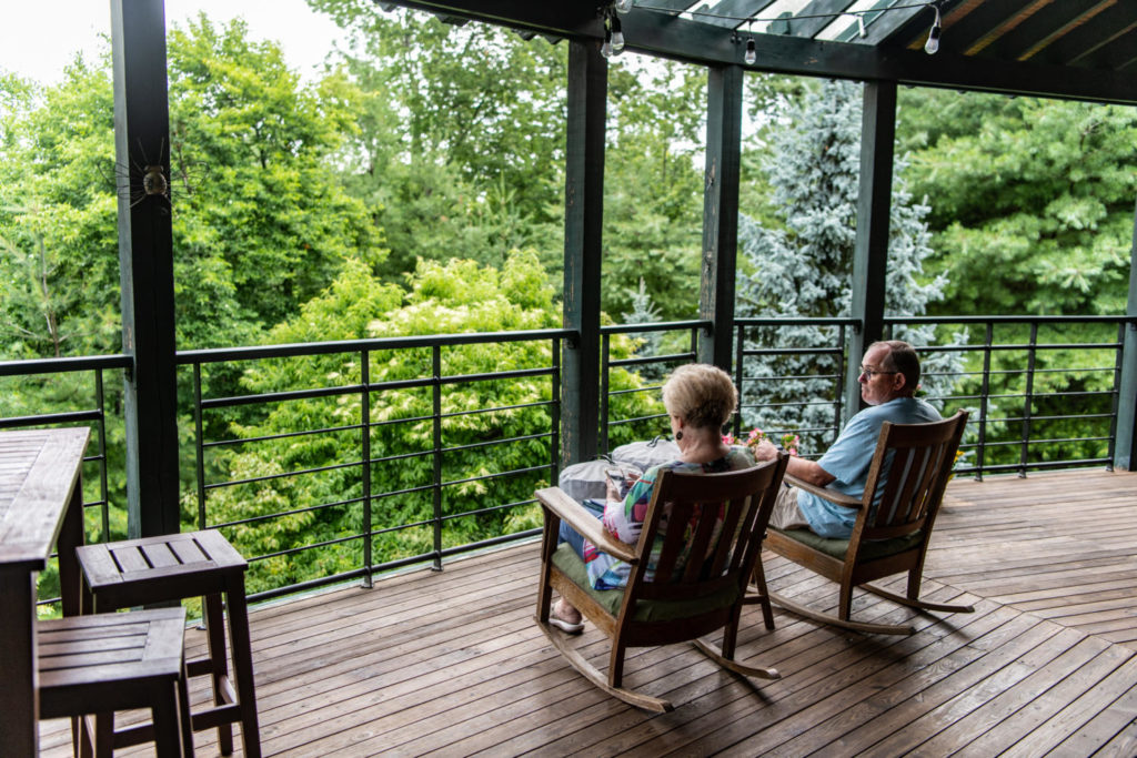 Couple relaxing on a porch